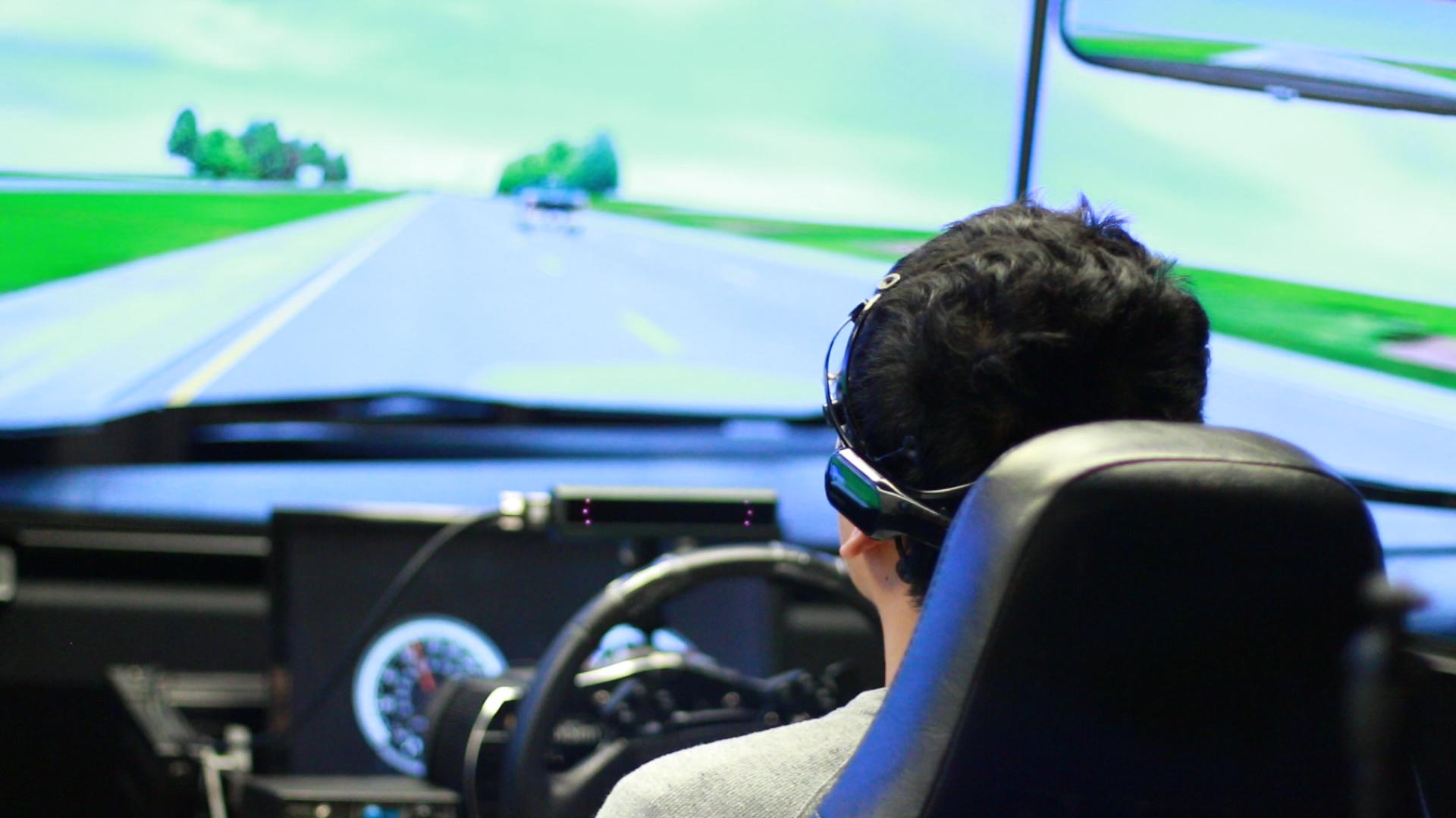 student using driving simulator in NHanCE Lab